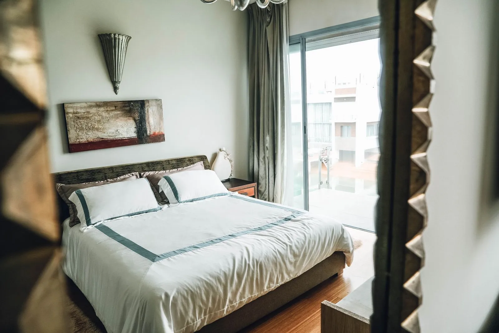 Hotel bedroom interior with large glazed window — integral blind integral blind sealed units, hotel refurbishment