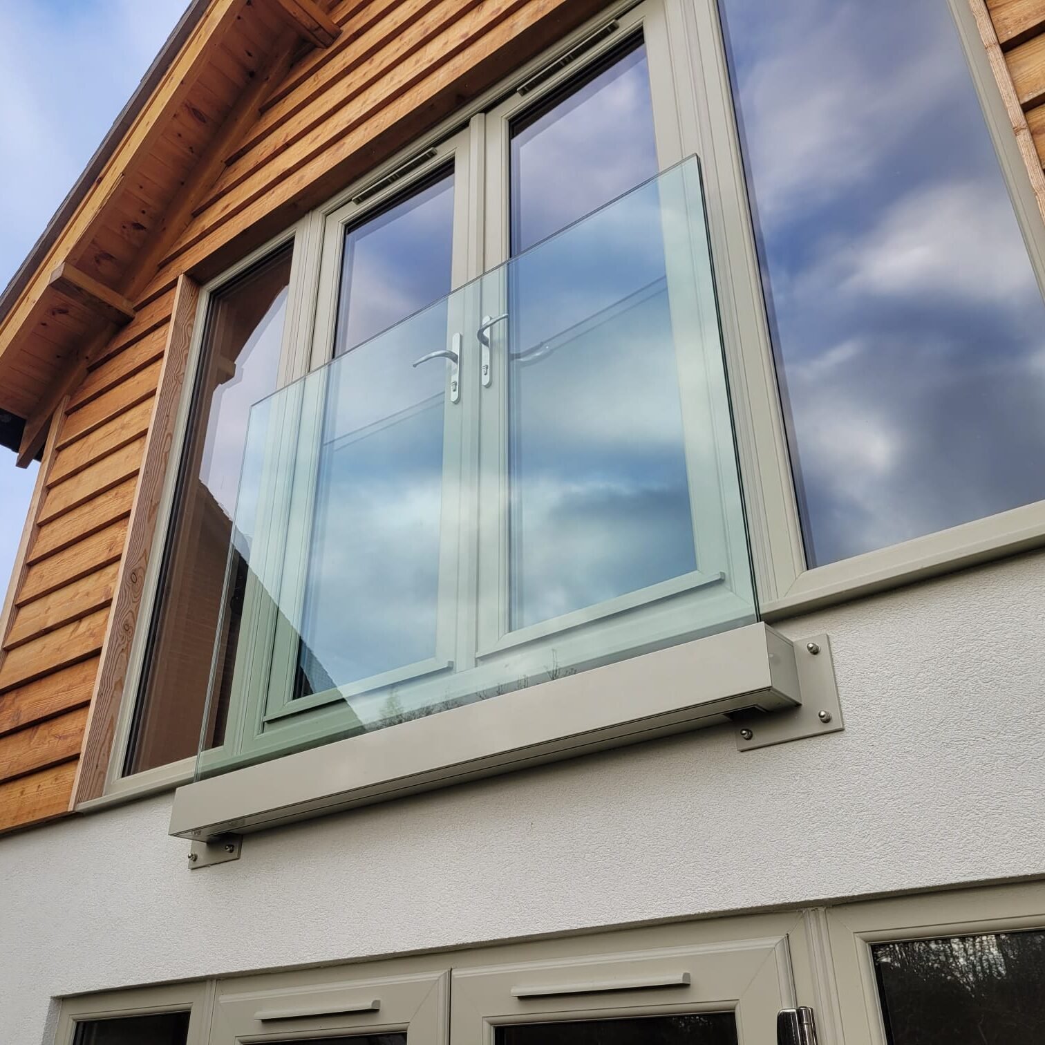 Juliet balcony glass across full-height doors