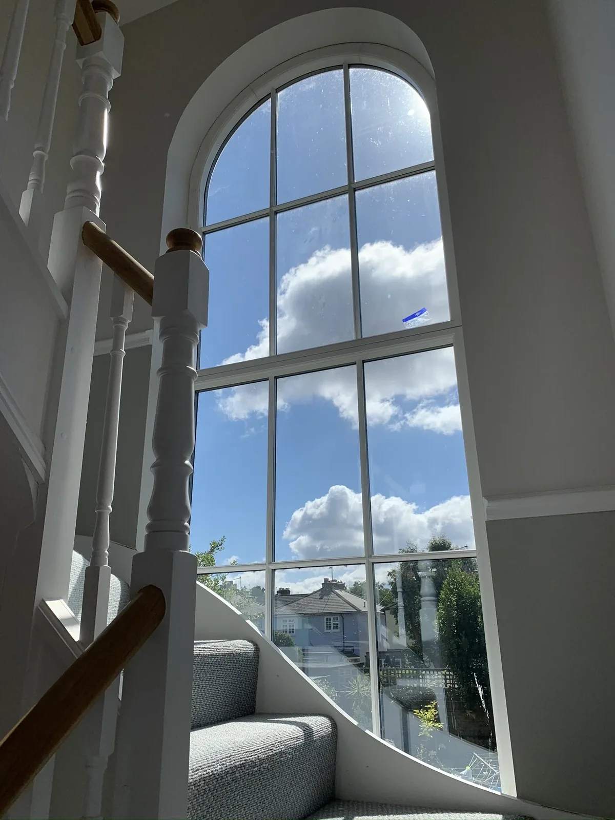 Arched shaped glass unit